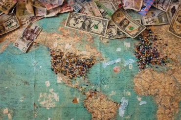 A budget-friendly map of the world covered in digital currency.