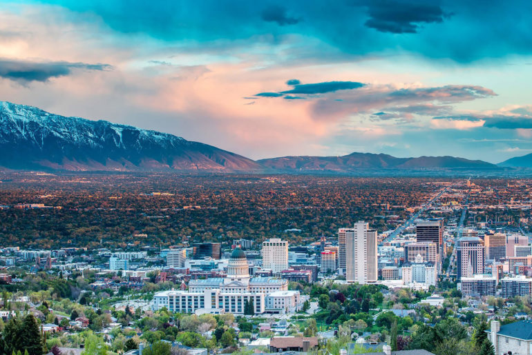 A breathtaking view of a digital nomad city nestled among majestic mountains.