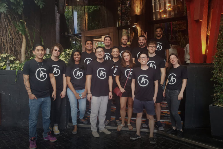 a group of people standing next to each other.