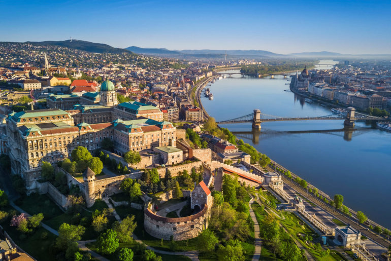 an aerial view of a city and a river.