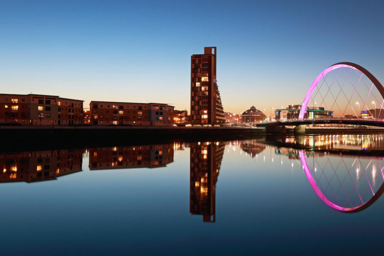 A picturesque bridge over a serene body of water, perfect for satisfying one's wanderlust.