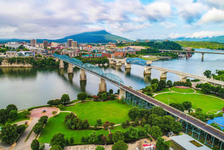 an aerial view of a bridge over a river.