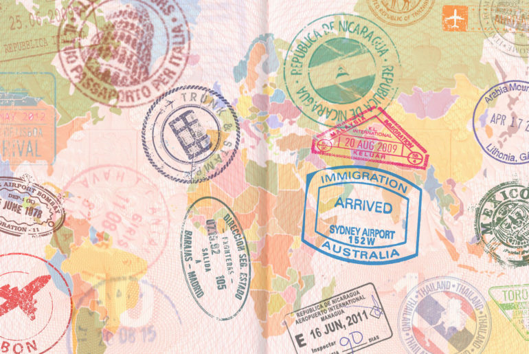A passport with digital nomad visa stamps on it.
