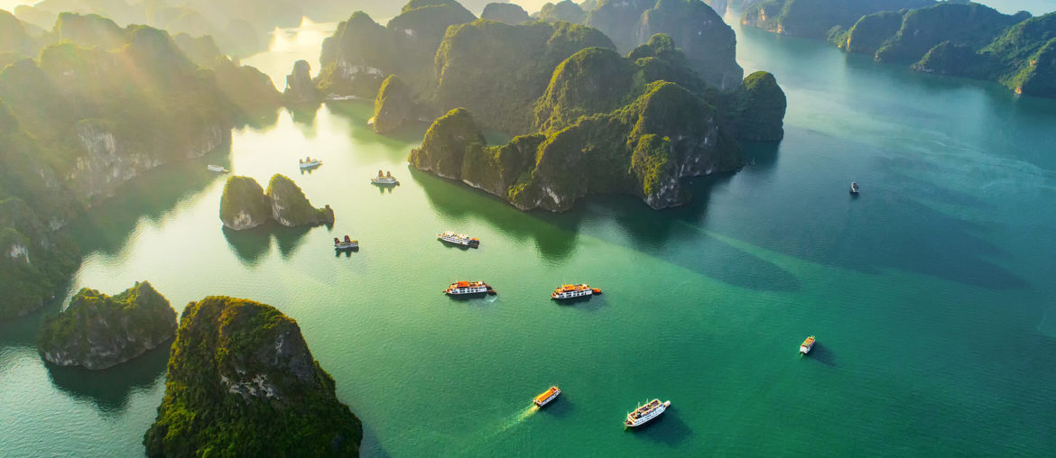 a group of boats floating on top of a body of water.
