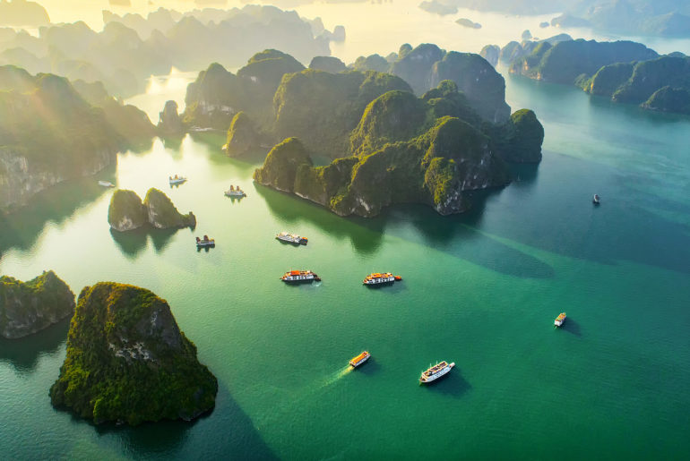 a group of boats floating on top of a body of water.