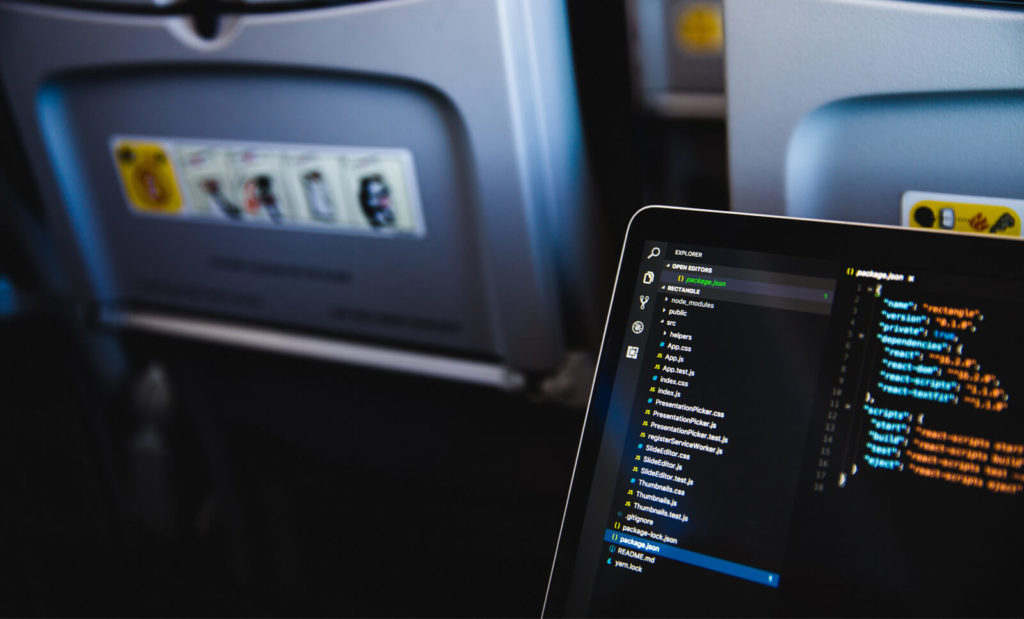 developer digital nomad working on an airplane