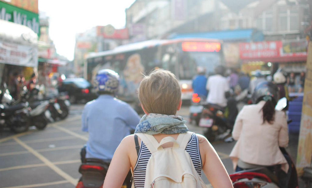 woman walking around market feeling lonely