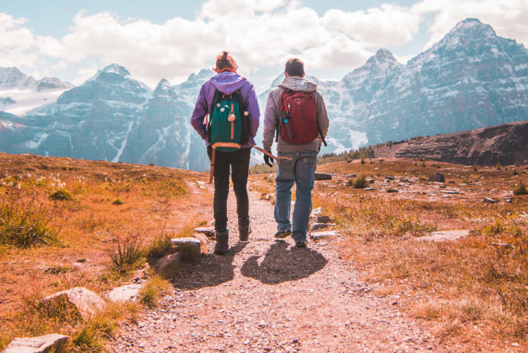 digital nomads hiking with their digital nomad packing list in tow