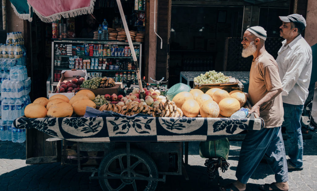 man selling fruit in marrakech