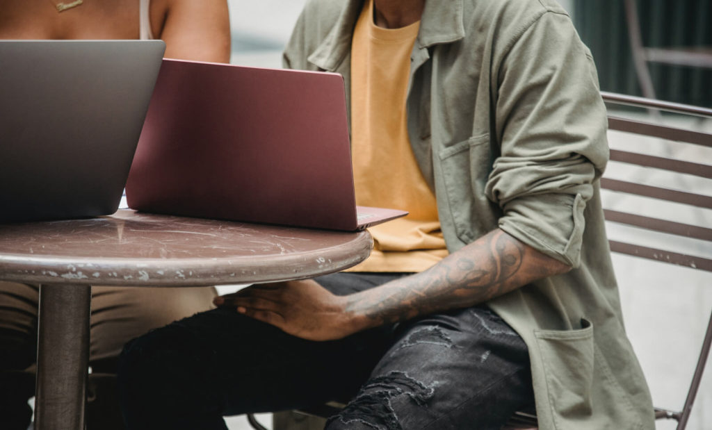 working on a laptop at a cafe