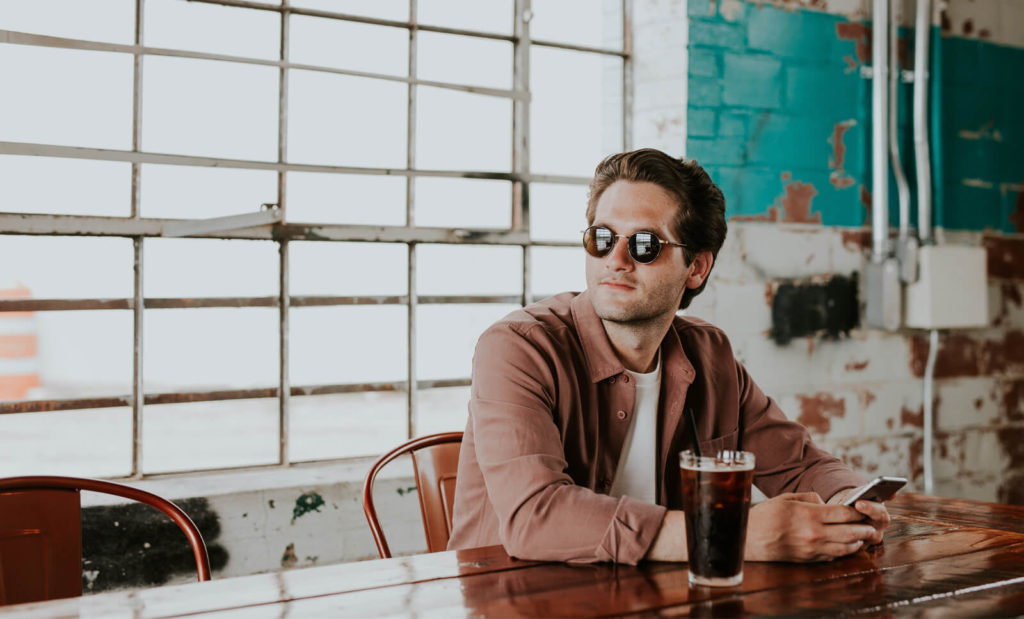 guy taking a break at a cafe