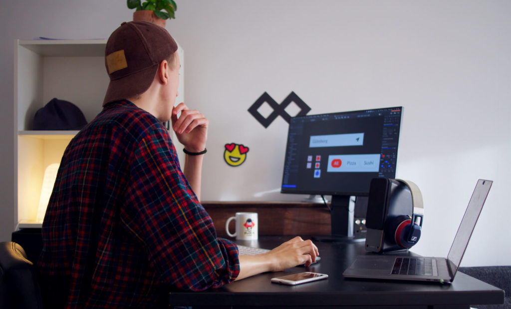 man working remotely on computer