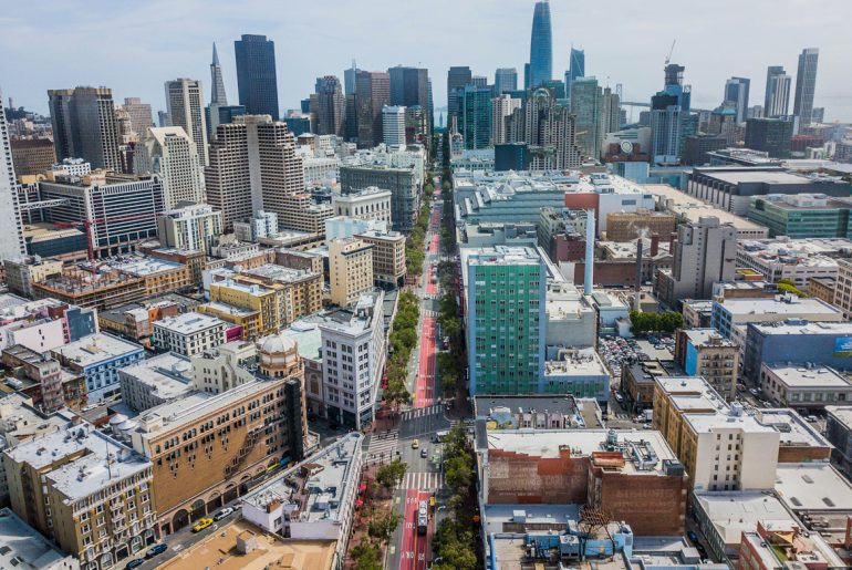 an aerial view of a city with tall buildings.