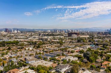 an aerial view of a city with tall buildings.