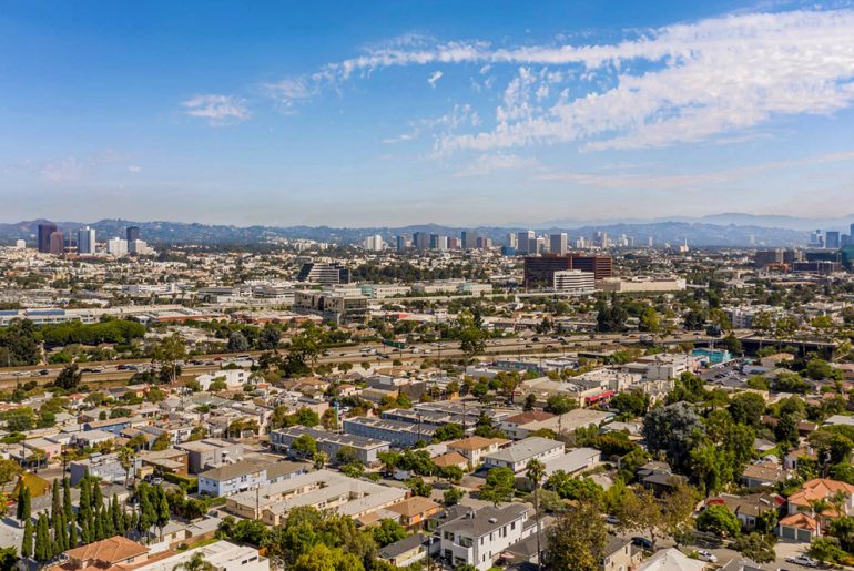 an aerial view of a city with tall buildings.