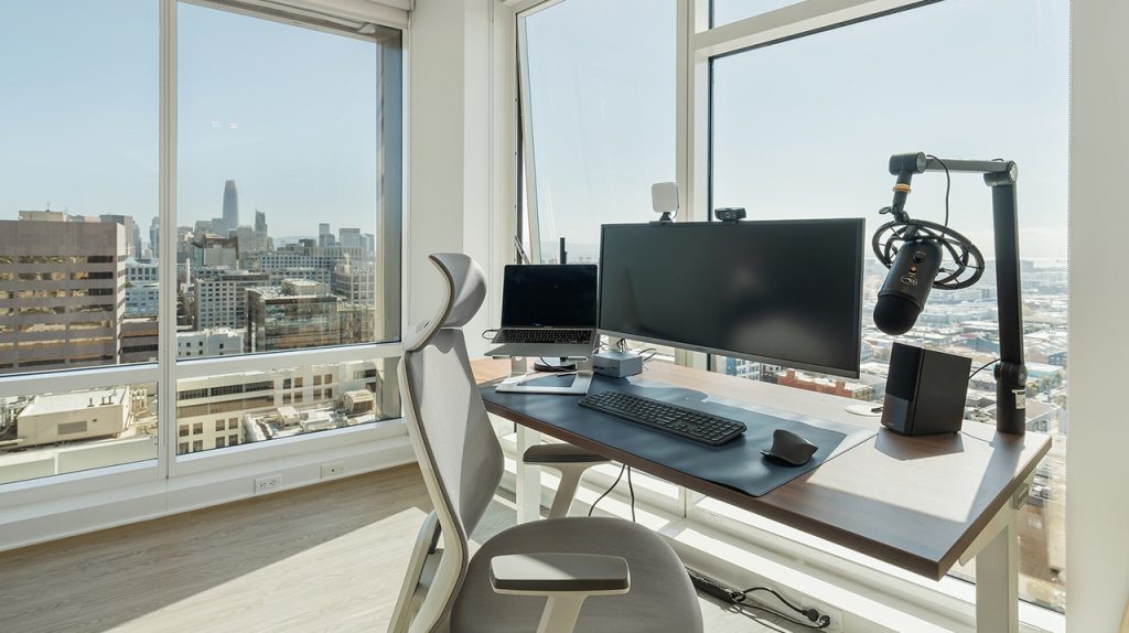 A workation desk with a view of a city.